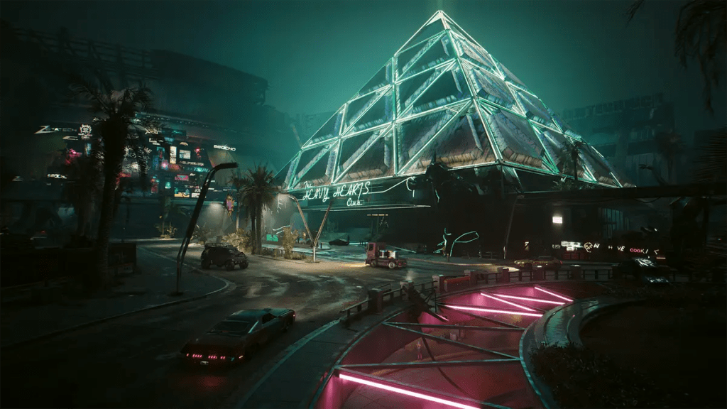 A pyramid-shaped building with a teal neon glow of fluorescent lights in the city of Dogtown.
